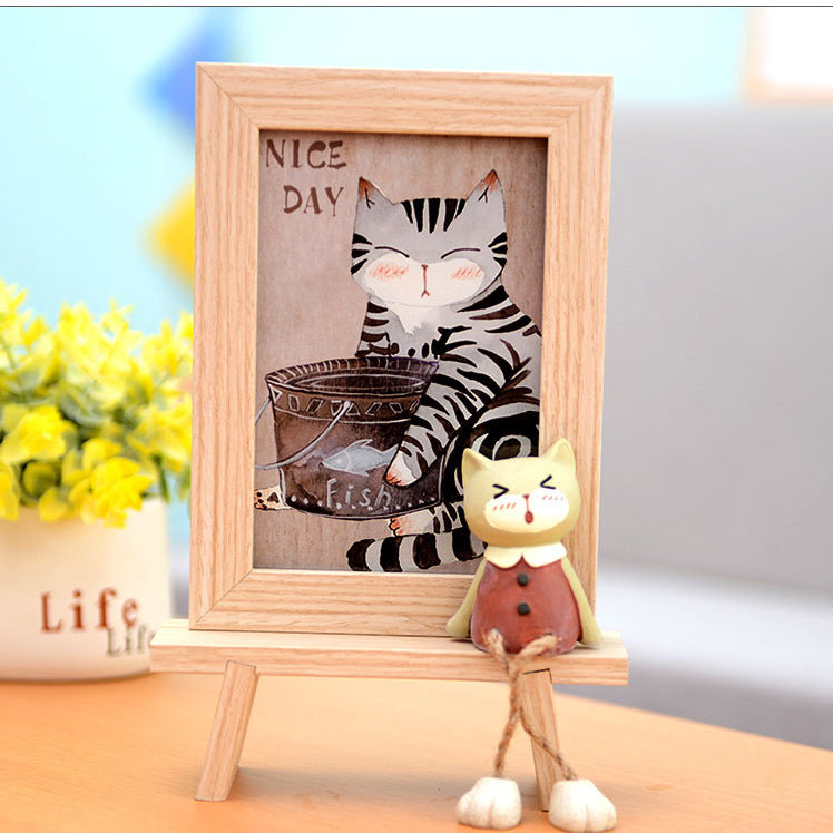 Bonito marco de fotos de madera con gatito para niños.